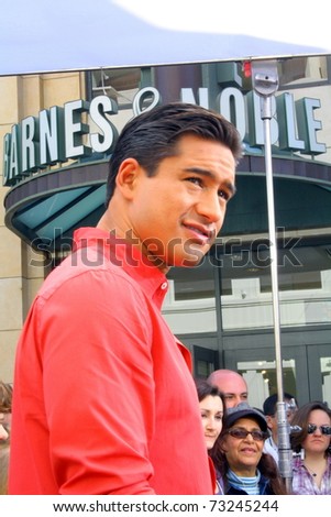 LOS ANGELES - MARCH 15: Tabloid television host and actor Mario Lopez films the tv show EXTRA at The Grove shopping mall on March 15, 2011 in Los Angeles, CA.