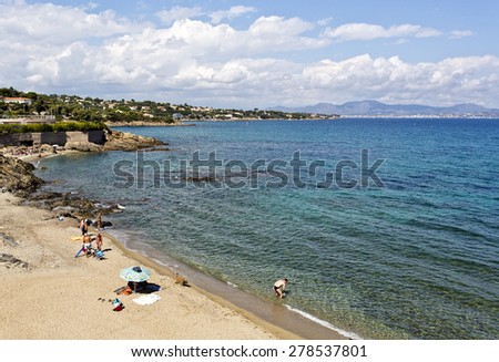 FRENCH RIVIERA, FRANCE - SEPTEMBER 12, 2014: Enjoying the warm water of the Mediterranean Sea in the French Riviera