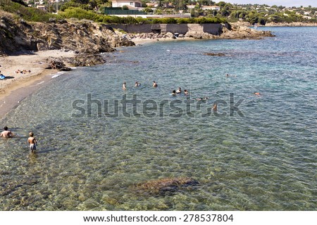 FRENCH RIVIERA, FRANCE - SEPTEMBER 12, 2014: Enjoying the warm water of the Mediterranean Sea in the French Riviera