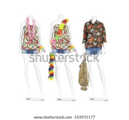Fashion clothing on mannequin in short jeans with bag and colorful flowers lei