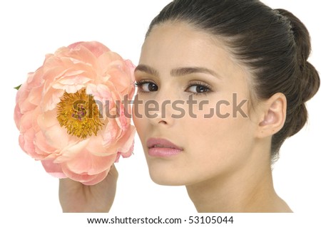 Face of a beautiful woman holding tree-peony flower
