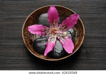 Zen Still Life-bowl of orchid and zen stones on bamboo stick straw mat