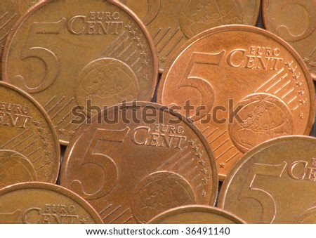 Array of five euro-cent coins, containing one shiny one