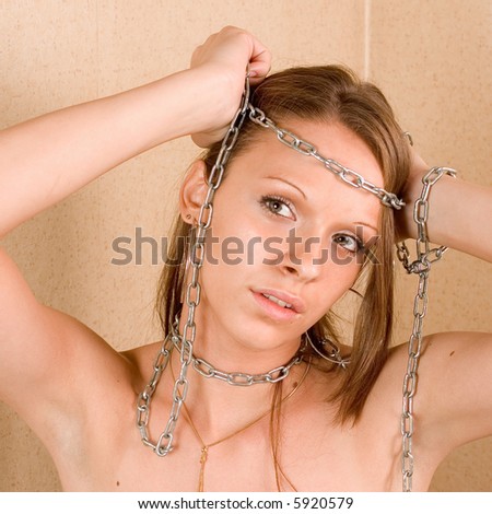Portrait of a young sensual woman with chain