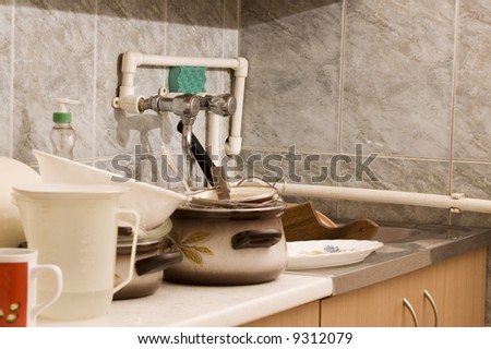 Dirty dishes on sink in the kitchen