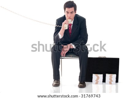 Businessman using phone absorbed in thought about world crisis