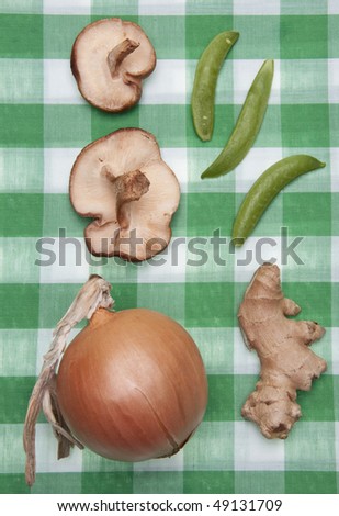 Group of Vegetables on a Green Checkered Cloth Ready for a Picnic.