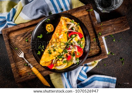 Healthy breakfast food, Stuffed egg omelette with vegetable, dark concrete background copy space top view Сток-фото © 