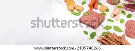 Similar – Image, Stock Photo Raw vegan cutlets on wooden board