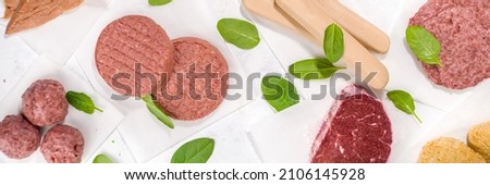 Similar – Image, Stock Photo Raw vegan cutlets on wooden board