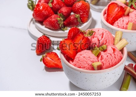 Image, Stock Photo Fresh strawberries and rhubarb on wooden table background with ingredients for tasty seasonal cooking or baking. Top view. Healthy clean food. Paleo dieting. Home cuisine. Garden fruits eating