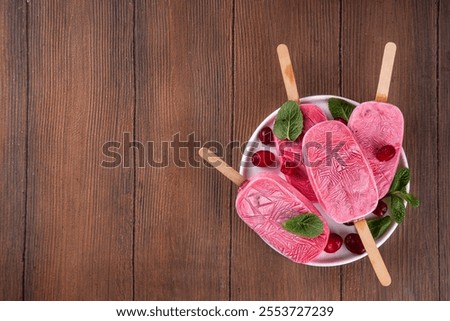 Similar – Image, Stock Photo Pink popsicles and fresh strawberries