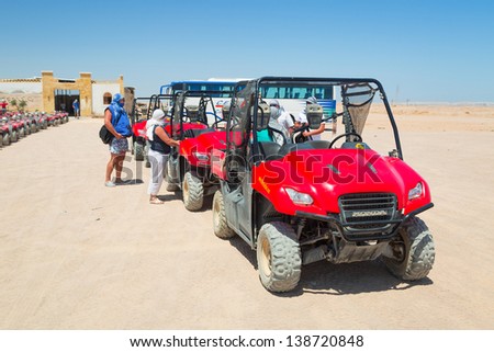 HURGHADA, EGYPT - APR 16: Unidentified people starting quad trip on the desert near Hurghada on 16 April 2013. Desert safari is one of the main local tourist attraction in Egypt.