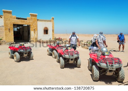 HURGHADA, EGYPT - APR 16: Unidentified people starting quad trip on the desert near Hurghada on 16 April 2013. Desert safari is one of the main local tourist attraction in Egypt.