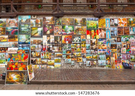 CRACOW, POLAND - JUNE 28:  Outdoor gallery on the city walls of Krakow on 28 June 2013. This famous street gallery is located on the city walls at St. Florian Gate, the focal point of Krakow old town.
