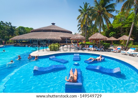 PLAYA DEL CARMEN, MEXICO - JULY 14: Scenery of luxury swimming pool at RIU Tequila Hotel  in Playa del Carmen on July 14, 2011. RIU Hotels & Resorts has more than 100 hotels in 19 countries.