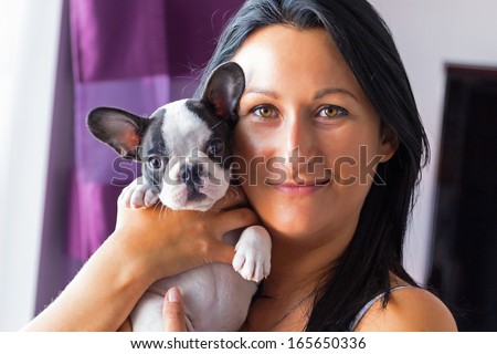Beautiful woman with french bulldog puppy