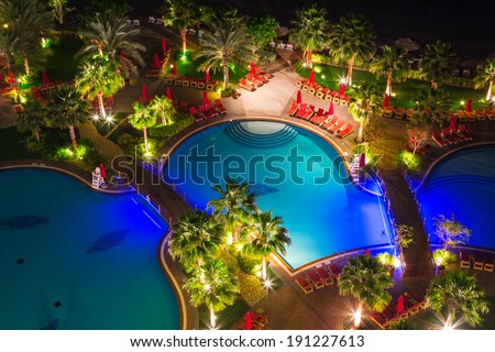 ABU DHABI, UAE - MARCH 26: Night at the pool area of Khalidiya Palace by Rotana on March 26, 2014, UAE. Rotana Hotel Management Corporation has 85 properties in 26 cities around Middle East and Africa