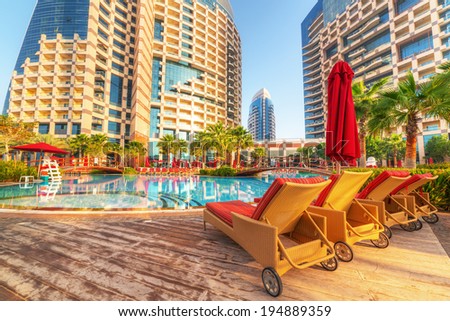 ABU DHABI, UAE - MARCH 30: Sunrise at the pool area of Khalidiya Palace by Rotana on March 30, 2014, UAE. Rotana Hotel Corporation has 85 properties in 26 cities around Middle East and Africa.