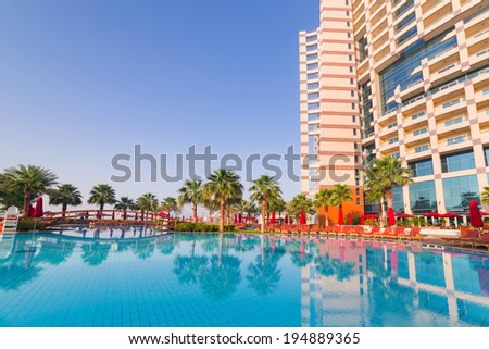 ABU DHABI, UAE - MARCH 30: Sunrise at the pool area of Khalidiya Palace by Rotana on March 30, 2014, UAE. Rotana Hotel Corporation has 85 properties in 26 cities around Middle East and Africa.
