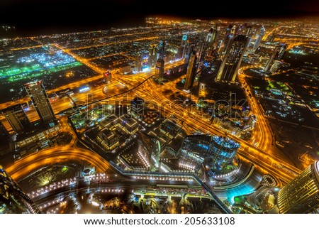 DUBAI, UAE -1 APRIL 2014: Panorama of city centre in Dubai at night, UAE. View from the 124 floor of Burj Khalifa - the tallest skyscraper in the world at 829.8m.