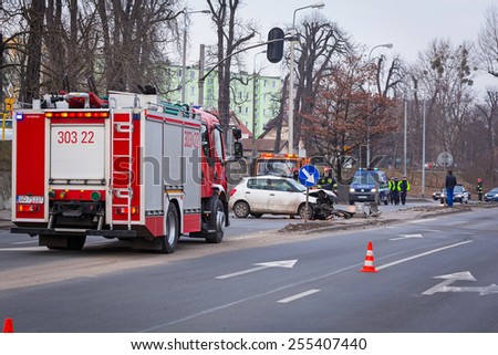 GDANSK, POLAND - FEBRUARY 21, 2015: The scene of a car crash on the road of Gdansk, Poland. Fire fighters and Police helping with a car traffic.