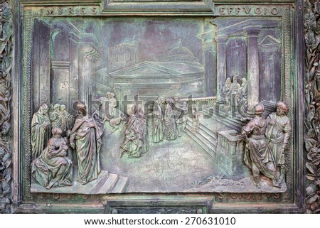 PISA, ITALY - APRIL 11, 2015: Reliefs on doors to the Cathedral at the Leaning Tower of Pisa, Italy. Pisa is a city in Tuscany known worldwide for the Leaning Tower, one of the biggest landmark.