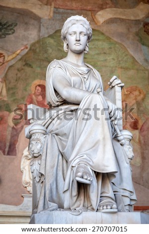 PISA, ITALY - APRIL 11, 2015: Sculpture in the Monumental Cemetery at the Leaning Tower of Pisa, Italy. Pisa is a city in Tuscany known worldwide for the Leaning Tower, one of the biggest landmark.