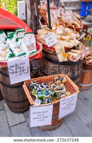 RIOMAGGIORE, ITALY - APRIL 12, 2015: Traditional italian food on the market of Riomaggiore in Italy. Riomaggiore is one of five famous coastline villages in the Cinque Terre National Park.