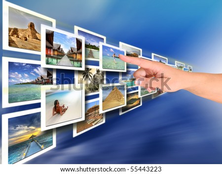 Woman hand choosing a holiday -  all pictures are coming from my gallery