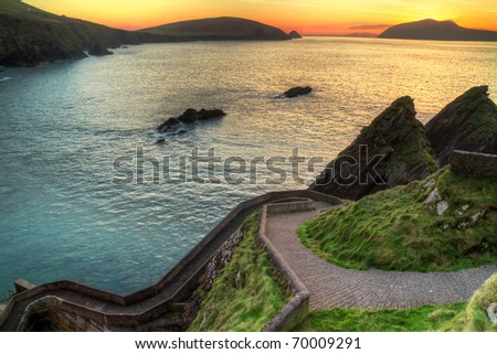 Sunset over pathway leading to Dunquin Pier on Dingle Peninsula, Co.Kerry, Ireland - HDR