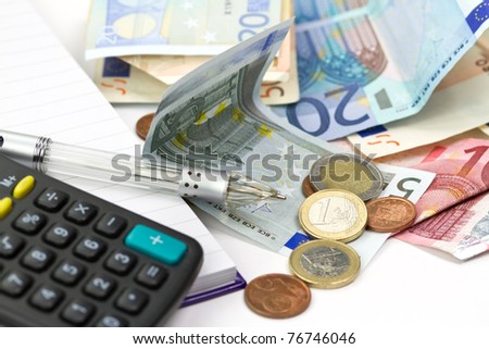Euro money counting with calculator and pen