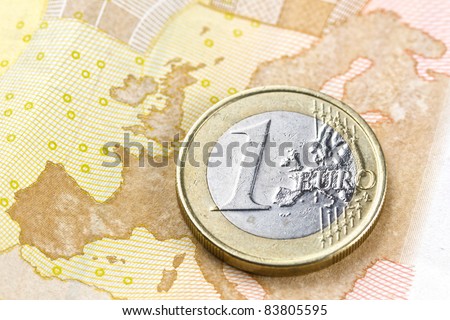 Euro coin on euro map composition from euro banknote revers