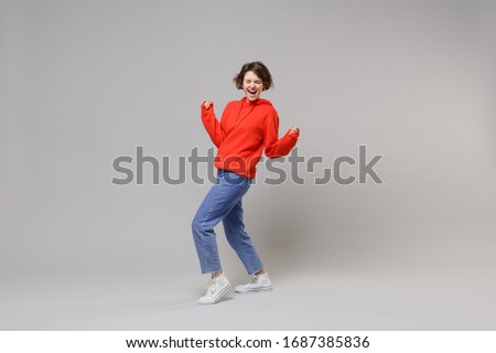 Similar – Image, Stock Photo Teenagers stand with closed eyes in front of a bright wooden wall and enjoy the wind in their hair.