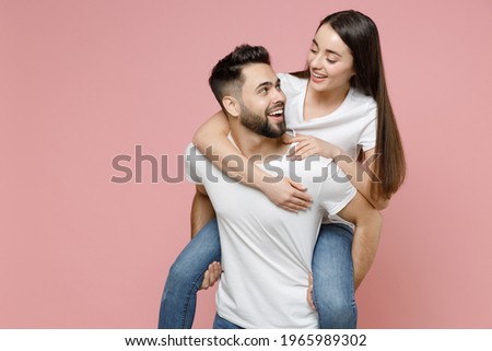 Similar – Image, Stock Photo Woman piggyback on man on street.