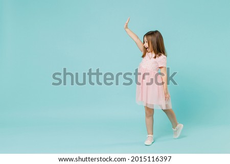 Similar – Image, Stock Photo Amazed happy little girl unwrapping birthday present party at home