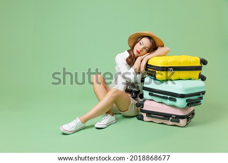 Similar – Image, Stock Photo Pensive woman traveler sitting near calm lake