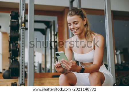 Similar – Image, Stock Photo Fitness Model Using Cell Phone