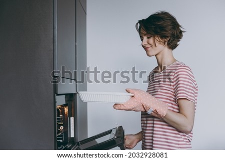 Similar – Image, Stock Photo Casserole is put in the oven