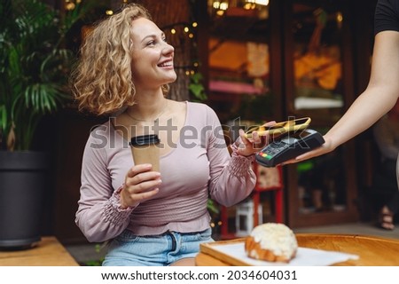 Similar – Image, Stock Photo Woman paying with mobile a take away order