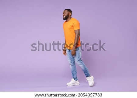 Similar – Image, Stock Photo Handsome Black Man Walking in Park and Listening to Earphones