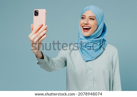 Similar – Image, Stock Photo Asian female taking selfie in underground passage