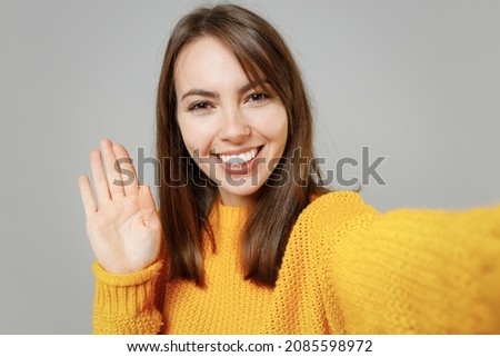 Similar – Image, Stock Photo A young woman says goodbye to an incredibly cuddly house cat. The cat enjoys the caresses in the sun on the stairs.
