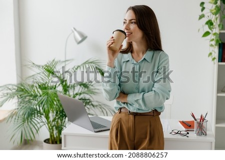 Similar – Image, Stock Photo Businesswoman with coffee cup on street