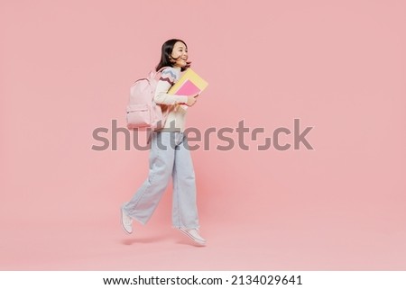 Similar – Image, Stock Photo Teenager girl with backpack and bike standing on metro station holding smart phone in hand, scrolling and texting, smiling and laughing. Futuristic bright subway station. Finland, Espoo