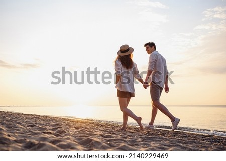 Similar – Image, Stock Photo Man resting in water with guitar at seaside