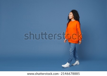 Similar – Image, Stock Photo Stylish black woman walking on city road with shadow