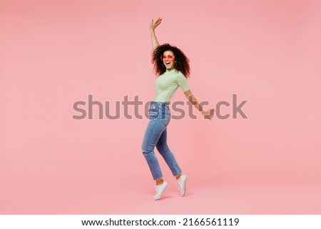 Similar – Image, Stock Photo Cool young woman lighting cigarette standing against amazing landscape of mountain ridge in cloudy weather