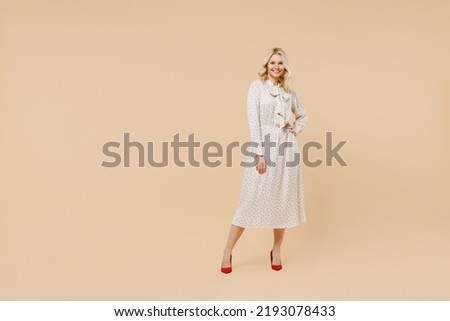 Similar – Image, Stock Photo Elegant woman in dress on brown background