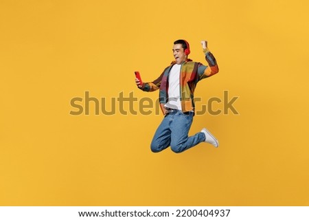 Similar – Image, Stock Photo Latin man listening to music with earphones.